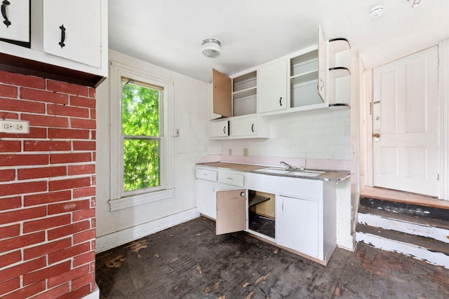 691 Burr St, Saint Paul, MN 55130 - kitchen featuring a sink, light countertops, white cabinets, and glass insert cabinets