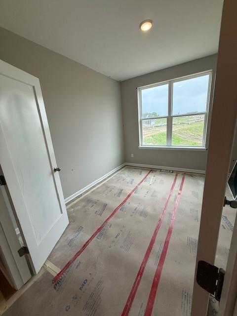 10051 Mulberry Ln, Corcoran, MN 55374 - unfurnished bedroom with baseboards and recessed lighting