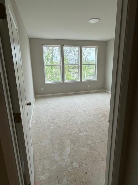 10051 Mulberry Ln, Corcoran, MN 55374 - spare room featuring baseboards