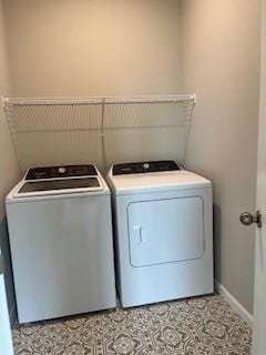 10051 Mulberry Ln, Corcoran, MN 55374 - washroom featuring independent washer and dryer, tile patterned floors, and baseboards
