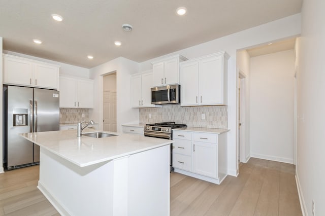 22615 Isla Way, Rogers, MN 55374 - kitchen with stainless steel appliances, a sink, backsplash, recessed lighting, and an island with sink