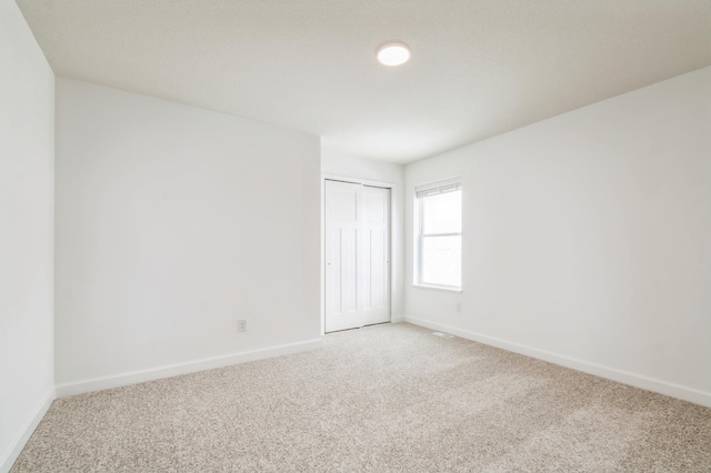 22615 Isla Way, Rogers, MN 55374 - unfurnished bedroom with light colored carpet and baseboards