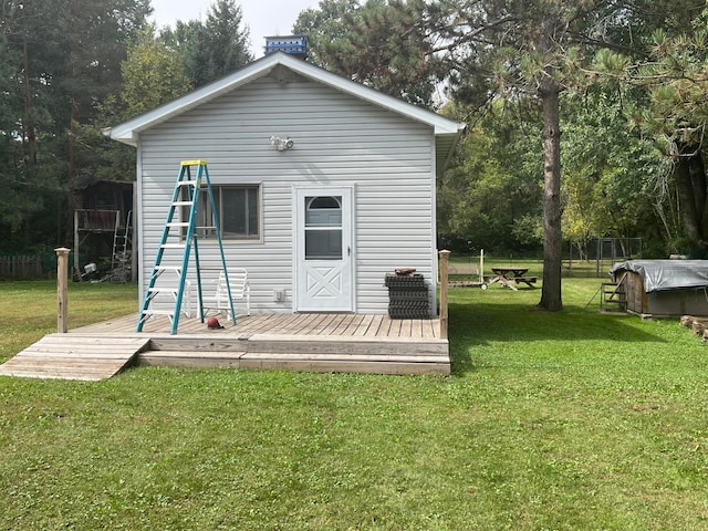 25070 Goodview Ave, Wyoming, MN 55092 - back of property featuring a lawn, a deck, and an outdoor structure
