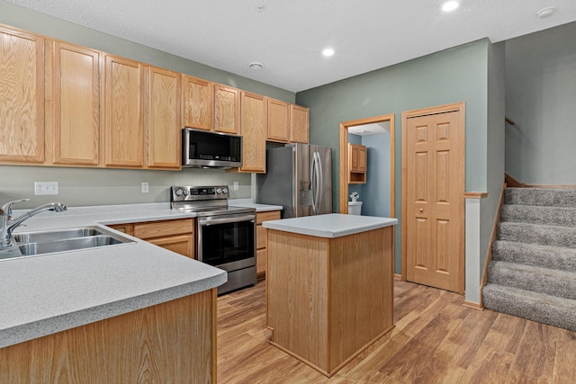 4707 Blaine Ave Unit 709, Inver Grove Heights, MN 55076 - kitchen with stainless steel appliances, a sink, light brown cabinetry, light countertops, and recessed lighting