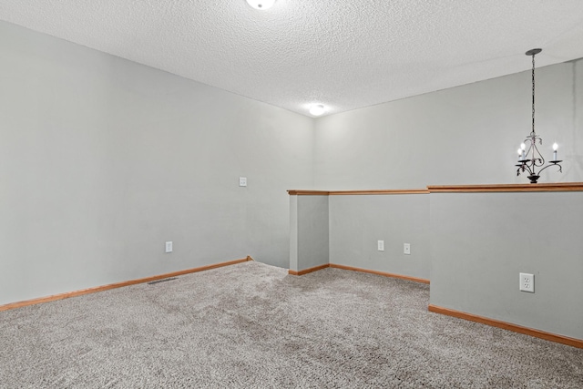 4707 Blaine Ave Unit 709, Inver Grove Heights, MN 55076 - unfurnished room featuring carpet floors, a textured ceiling, a chandelier, and baseboards