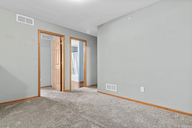 4707 Blaine Ave Unit 709, Inver Grove Heights, MN 55076 - unfurnished bedroom featuring carpet flooring, a textured ceiling, and baseboards