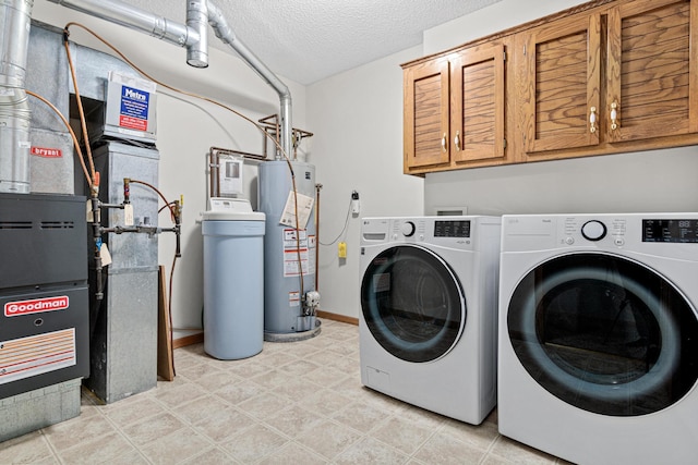 4707 Blaine Ave Unit 709, Inver Grove Heights, MN 55076 - laundry room with separate washer and dryer, cabinet space, heating unit, a textured ceiling, and baseboards