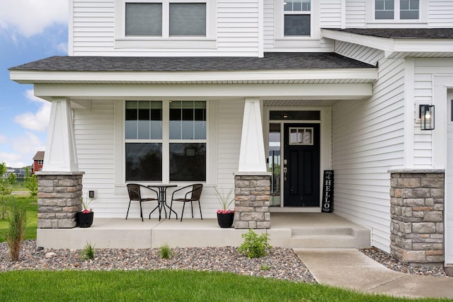 5282 Randolph Ave NE, Otsego, MN 55374 - entrance to property featuring covered porch, a shingled roof, and stone siding