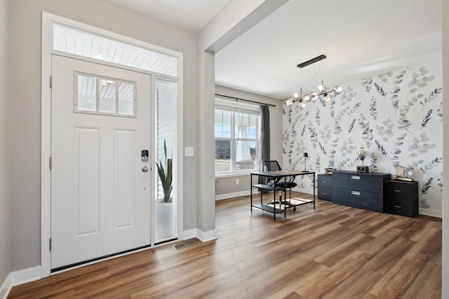 5282 Randolph Ave NE, Otsego, MN 55374 - foyer with a chandelier, wood finished floors, and baseboards