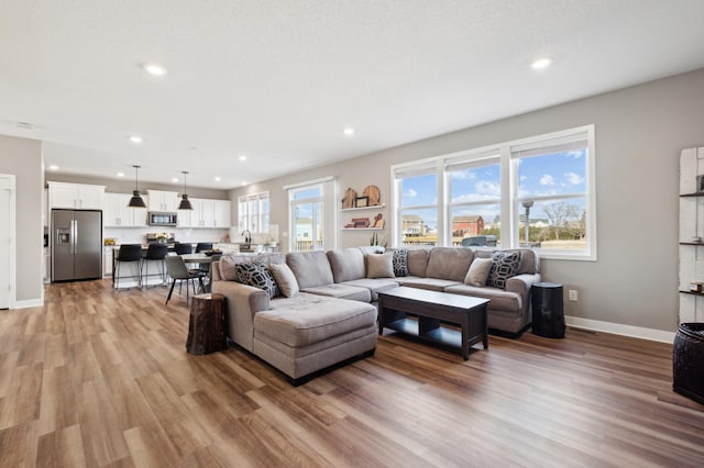 5282 Randolph Ave NE, Otsego, MN 55374 - living room with baseboards, light wood-style flooring, and recessed lighting