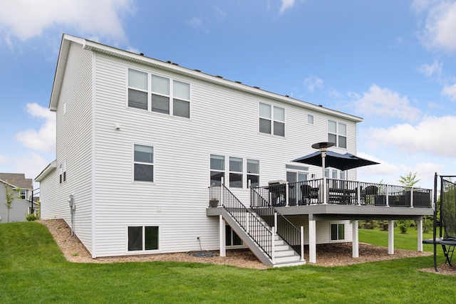 5282 Randolph Ave NE, Otsego, MN 55374 - rear view of house with a wooden deck, a lawn, and stairway