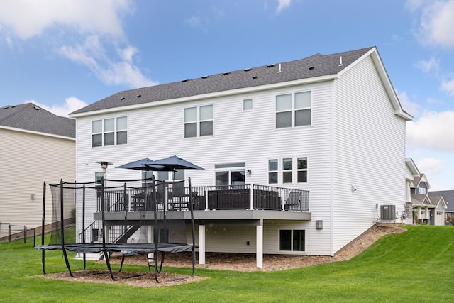 5282 Randolph Ave NE, Otsego, MN 55374 - rear view of house featuring central AC, a deck, and a lawn