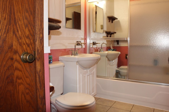 44500 Elmcrest Ave, Fish Lake Twp, MN 55032 - bathroom with toilet, tile patterned flooring, combined bath / shower with glass door, and vanity