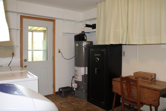 44500 Elmcrest Ave, Fish Lake Twp, MN 55032 - laundry room featuring water heater, washing machine and clothes dryer, and stone finish floors
