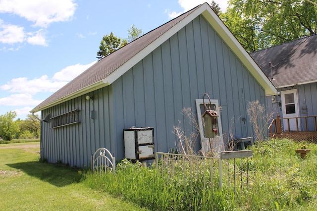44500 Elmcrest Ave, Fish Lake Twp, MN 55032 - view of home's exterior featuring board and batten siding, roof with shingles, and a lawn