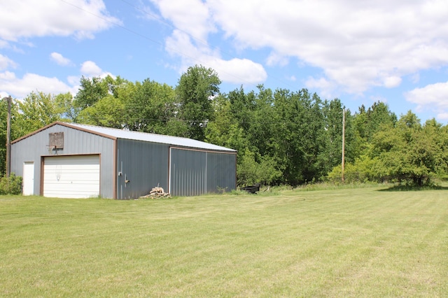 44500 Elmcrest Ave, Fish Lake Twp, MN 55032 - view of green lawn featuring a detached garage and an outdoor structure