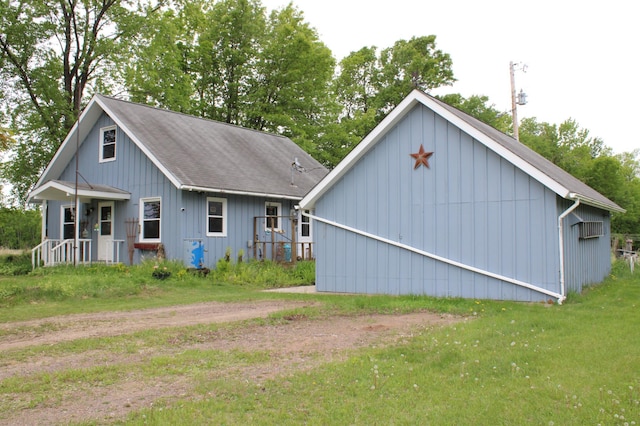 44500 Elmcrest Ave, Fish Lake Twp, MN 55032 - back of property featuring a lawn and a shingled roof