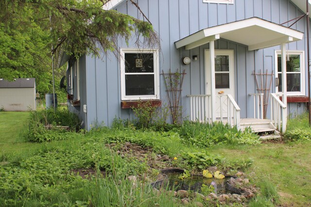 44500 Elmcrest Ave, Fish Lake Twp, MN 55032 - doorway to property featuring board and batten siding
