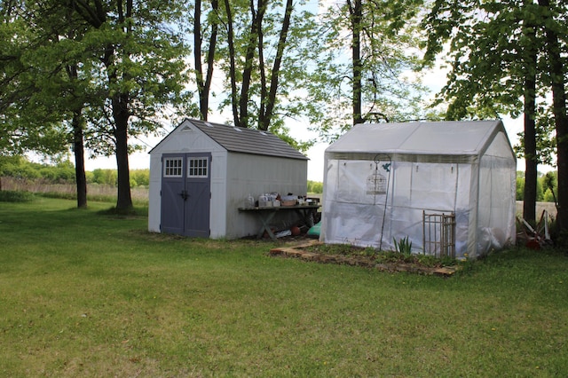 44500 Elmcrest Ave, Fish Lake Twp, MN 55032 - view of greenhouse featuring a yard and a shed