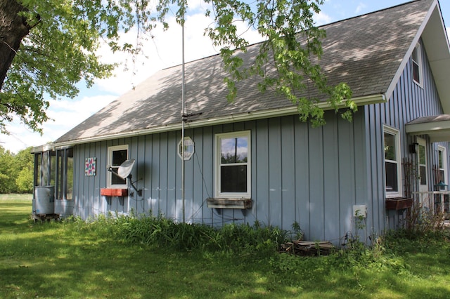 44500 Elmcrest Ave, Fish Lake Twp, MN 55032 - view of home's exterior featuring a shingled roof, board and batten siding, and a yard