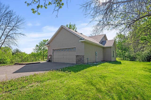 17260 Keystone Ave N, Hugo, MN 55038 - view of home's exterior with a garage, driveway, a yard, and a shingled roof