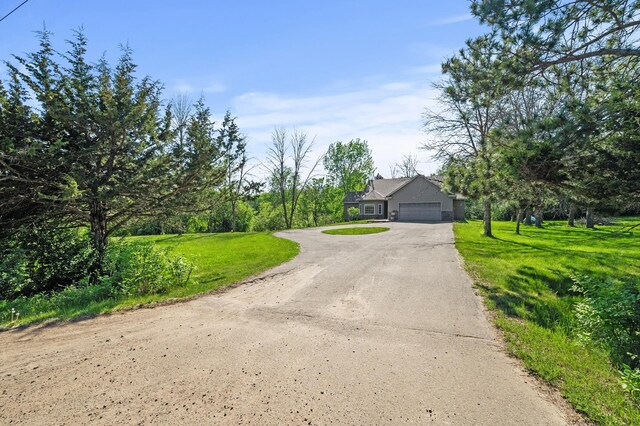 17260 Keystone Ave N, Hugo, MN 55038 - view of front of property featuring asphalt driveway, an attached garage, and a front yard