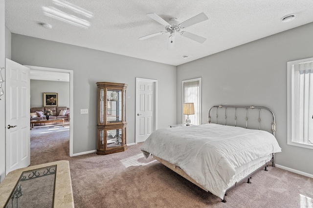17260 Keystone Ave N, Hugo, MN 55038 - carpeted bedroom featuring a textured ceiling, a ceiling fan, and baseboards