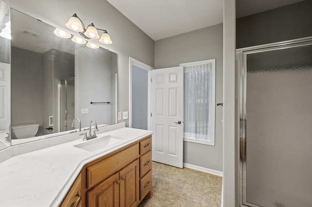 17260 Keystone Ave N, Hugo, MN 55038 - full bath featuring vanity, a shower stall, toilet, and baseboards