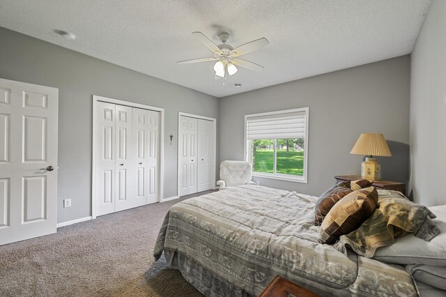 17260 Keystone Ave N, Hugo, MN 55038 - carpeted bedroom with multiple closets, baseboards, a textured ceiling, and a ceiling fan