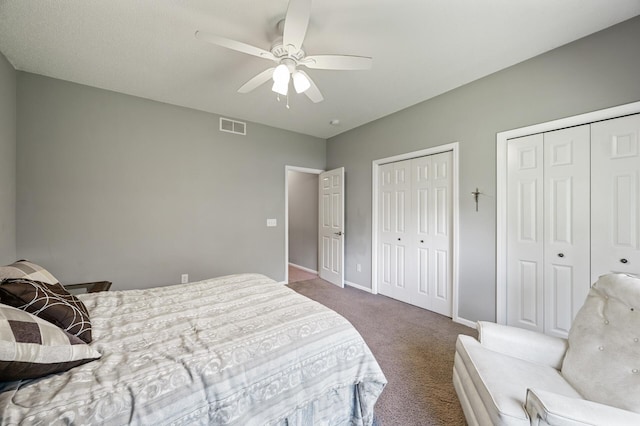 17260 Keystone Ave N, Hugo, MN 55038 - carpeted bedroom featuring two closets, baseboards, and a ceiling fan