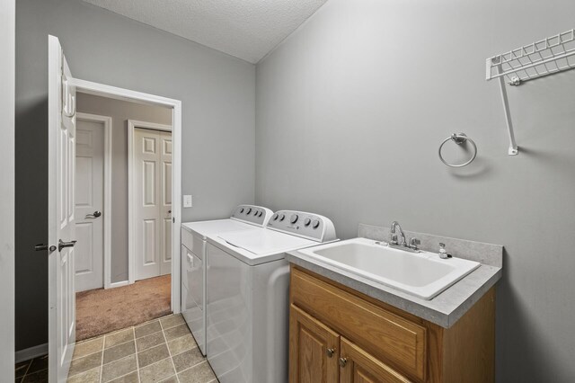 17260 Keystone Ave N, Hugo, MN 55038 - laundry room featuring washing machine and dryer, a sink, a textured ceiling, and light carpet
