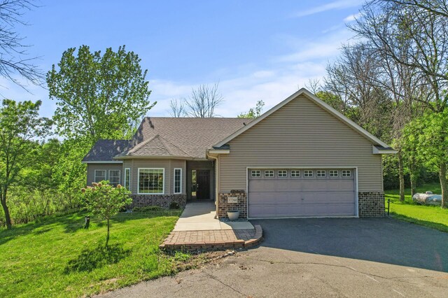 17260 Keystone Ave N, Hugo, MN 55038 - view of front facade with an attached garage, asphalt driveway, a front lawn, and brick siding