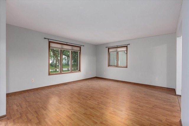 106 1/2 N St, Hudson, WI 54016 - unfurnished room with light wood finished floors and baseboards
