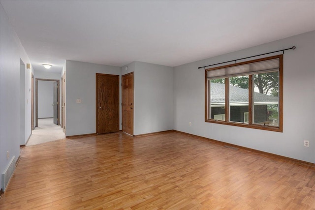 106 1/2 N St, Hudson, WI 54016 - empty room with light wood-style floors and baseboards
