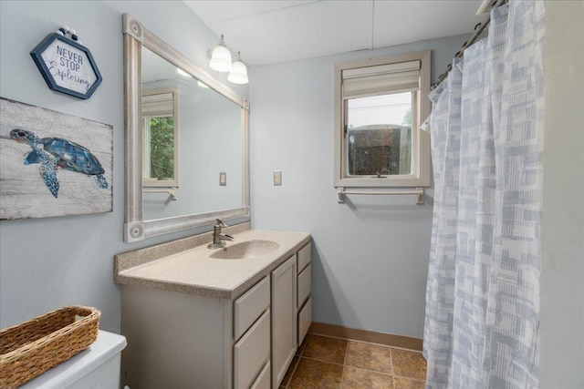 106 1/2 N St, Hudson, WI 54016 - bathroom featuring toilet, vanity, and baseboards