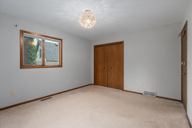106 1/2 N St, Hudson, WI 54016 - unfurnished bedroom featuring carpet flooring, a closet, and baseboards