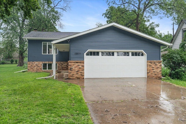 106 1/2 N St, Hudson, WI 54016 - view of front of home featuring brick siding, a front lawn, concrete driveway, a garage, and a chimney