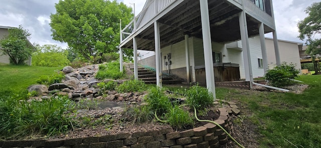 302 8th Ave S, Buffalo, MN 55313 - view of property exterior with stairway and a lawn