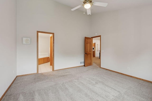 11202 Virginia Rd, Bloomington, MN 55438 - empty room with high vaulted ceiling, light colored carpet, and ceiling fan