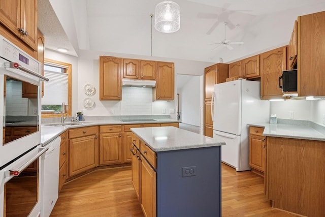 11202 Virginia Rd, Bloomington, MN 55438 - kitchen with black appliances, under cabinet range hood, light wood-type flooring, tasteful backsplash, and vaulted ceiling