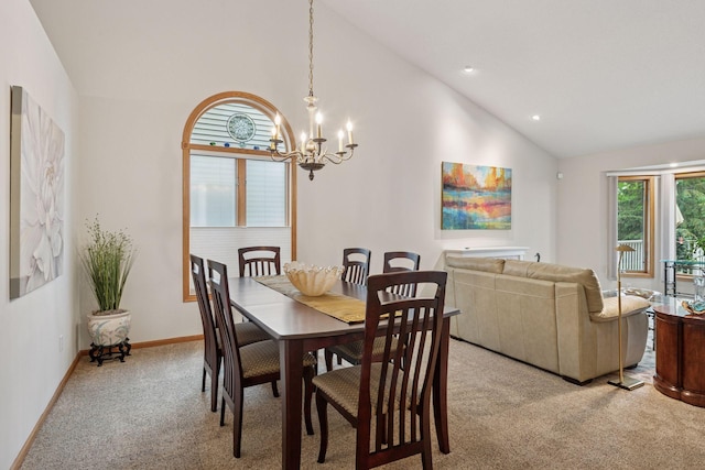 11202 Virginia Rd, Bloomington, MN 55438 - dining space featuring light colored carpet, a chandelier, and high vaulted ceiling