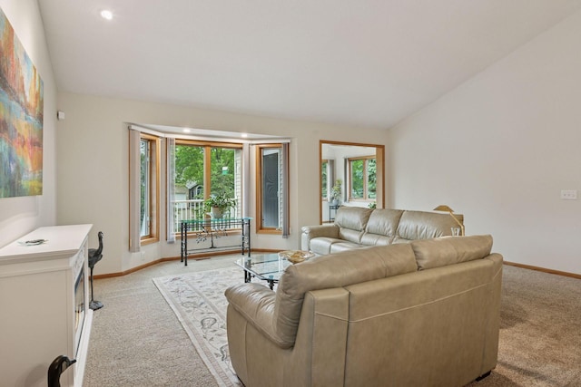 11202 Virginia Rd, Bloomington, MN 55438 - living room featuring light colored carpet and vaulted ceiling