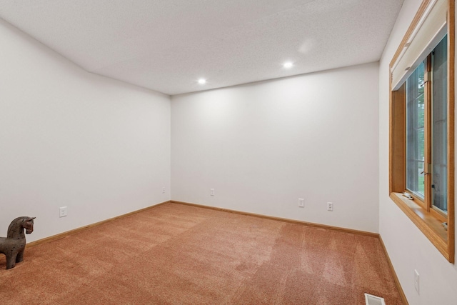 11202 Virginia Rd, Bloomington, MN 55438 - empty room featuring light colored carpet, recessed lighting, and a textured ceiling