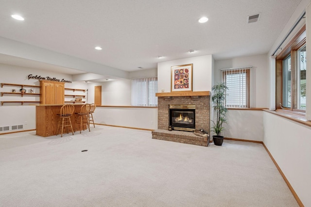 11202 Virginia Rd, Bloomington, MN 55438 - carpeted living room featuring wet bar, recessed lighting, and a fireplace