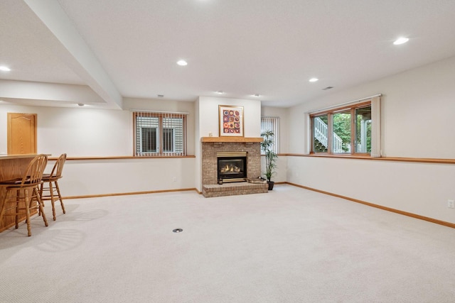 11202 Virginia Rd, Bloomington, MN 55438 - carpeted living area with recessed lighting, a bar, and a brick fireplace