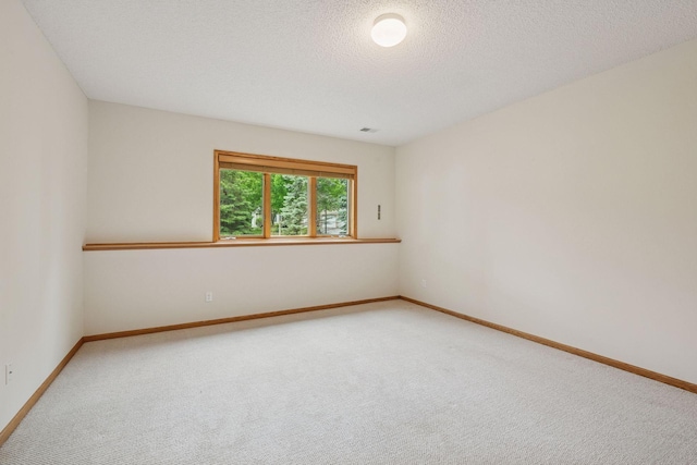 11202 Virginia Rd, Bloomington, MN 55438 - carpeted empty room with baseboards and a textured ceiling
