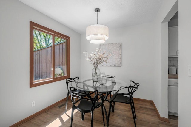 212 Eagle Lake Dr, Maple Grove, MN 55369 - dining area with wood finished floors and baseboards