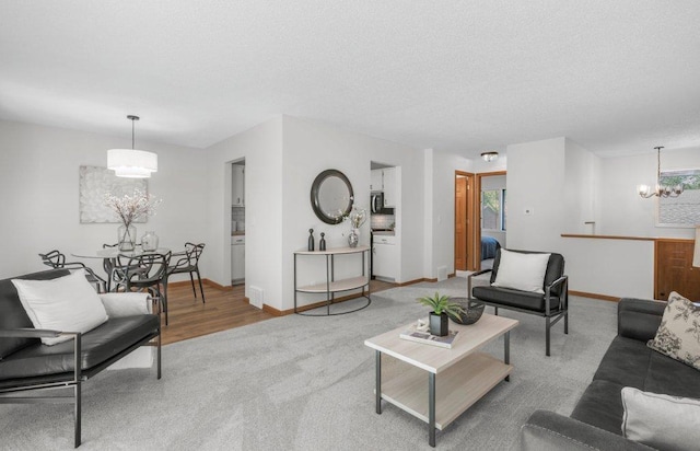 212 Eagle Lake Dr, Maple Grove, MN 55369 - carpeted living room with a chandelier, baseboards, a textured ceiling, and healthy amount of natural light