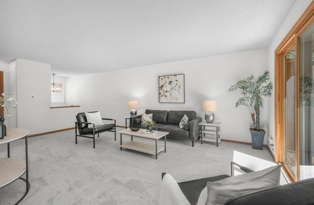 212 Eagle Lake Dr, Maple Grove, MN 55369 - living room featuring light colored carpet, a chandelier, a textured ceiling, and baseboards