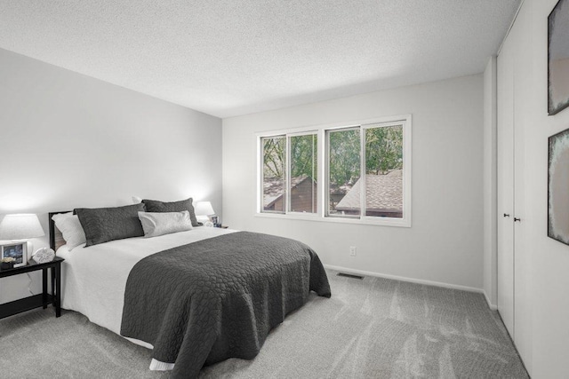 212 Eagle Lake Dr, Maple Grove, MN 55369 - bedroom featuring carpet, a textured ceiling, and baseboards